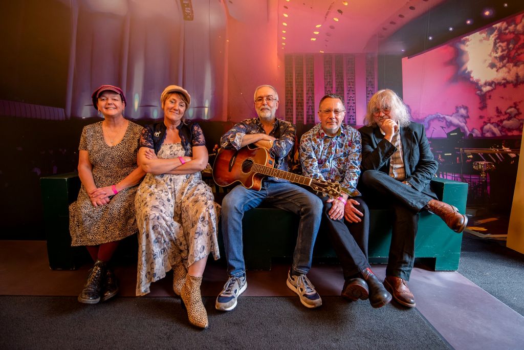 Virginia Kettle's Rolling Folk band sat on a settee